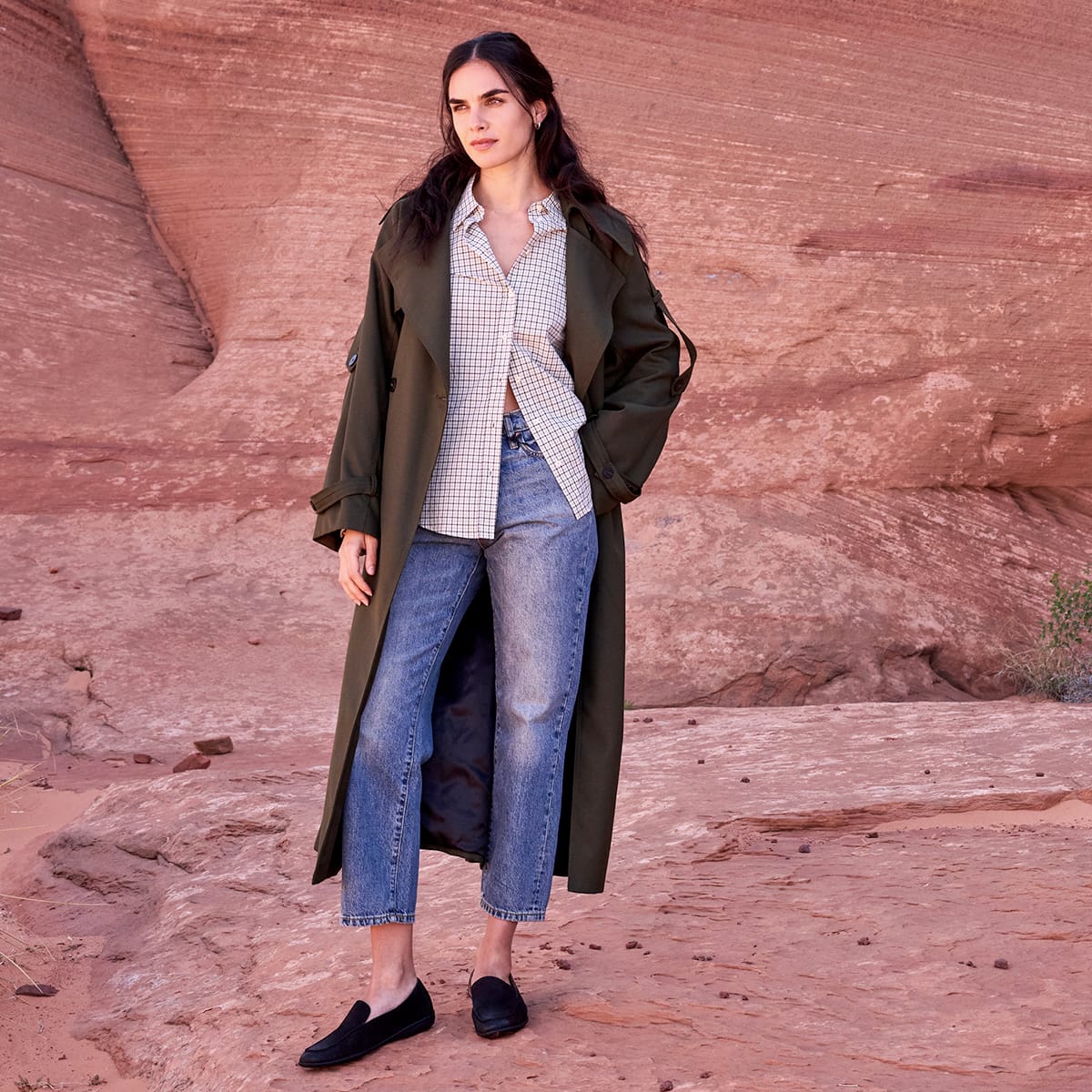 A woman wearing the Fawn loafer in black suede.